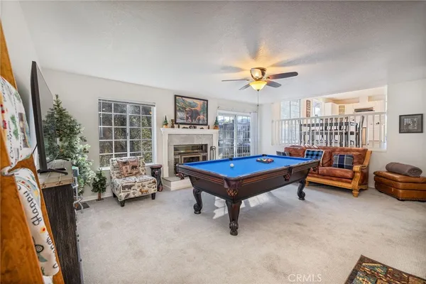 a living room with furniture a table and a potted plant