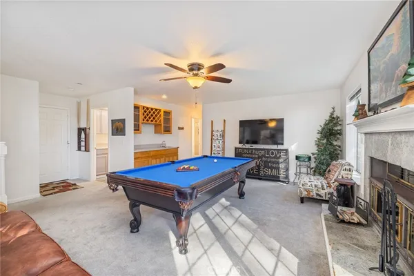 a room with pool table table and a flat screen tv