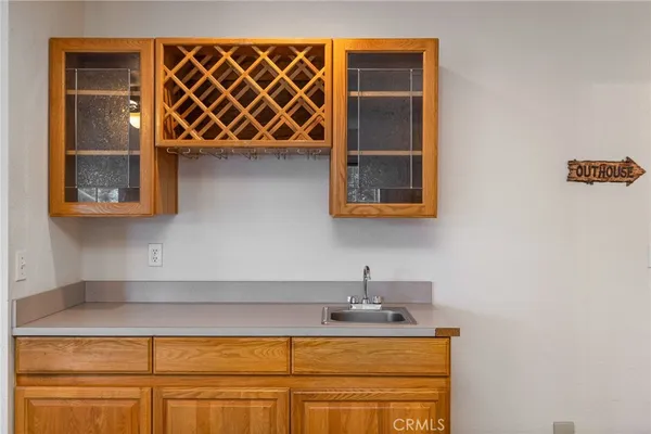a kitchen with a sink and cabinets
