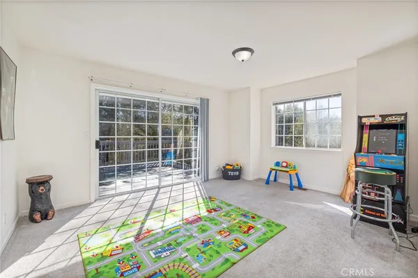 a bedroom with furniture and a window