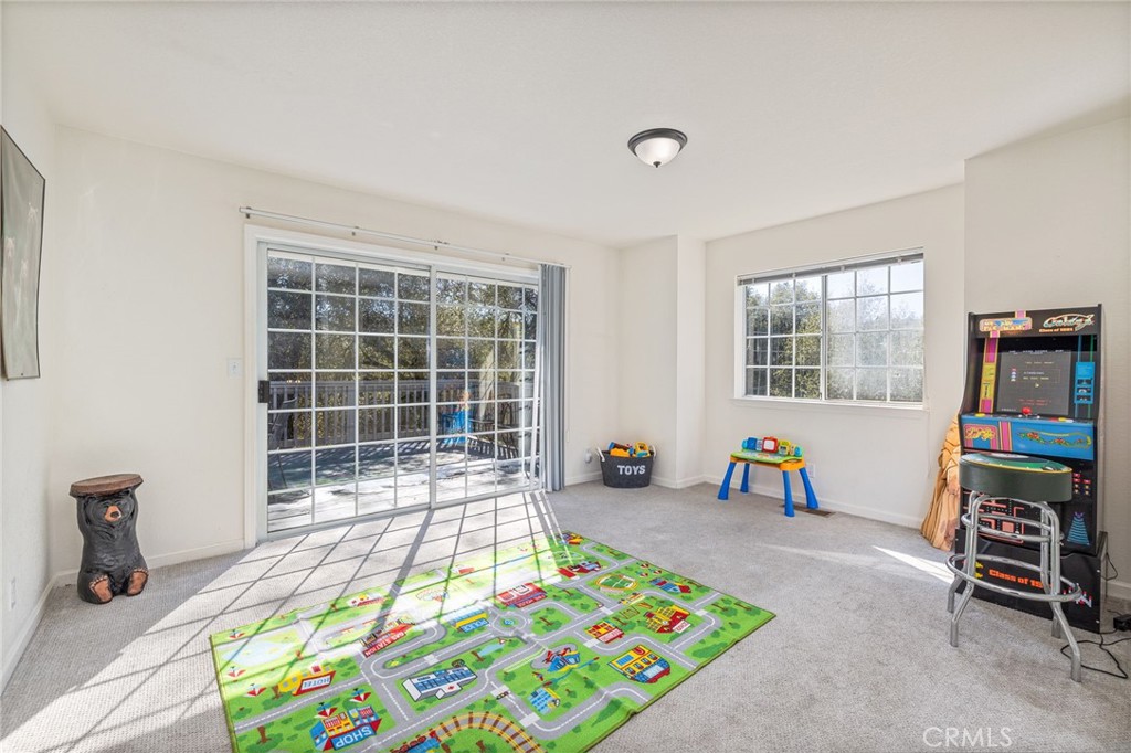 39301 Moonray Lane Oakhurst, CA 93644 - Photo 21 of 55 a bedroom with furniture and a window