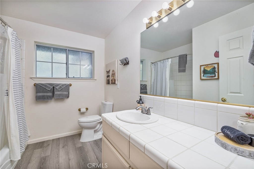 39301 Moonray Lane Oakhurst, CA 93644 - Photo 34 of 55 a bathroom with a sink toilet and shower