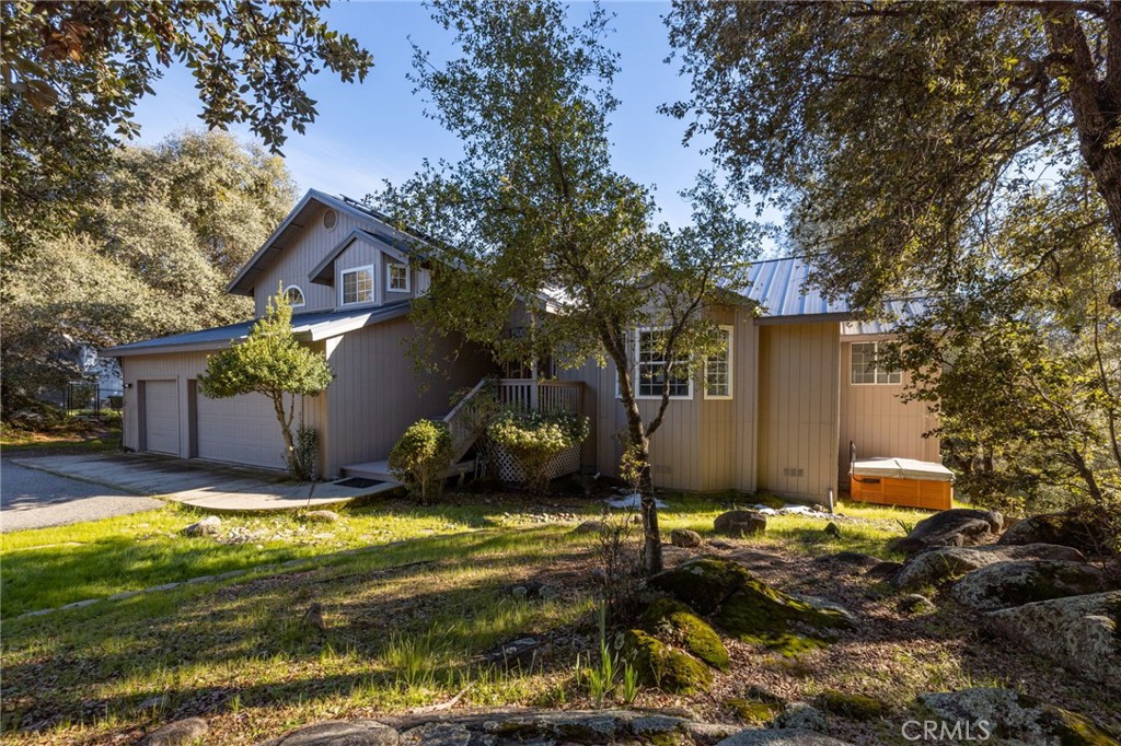 39301 Moonray Lane Oakhurst, CA 93644 - Photo 42 of 55 a view of a house with a yard