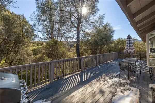 a view of a city with lush green forest