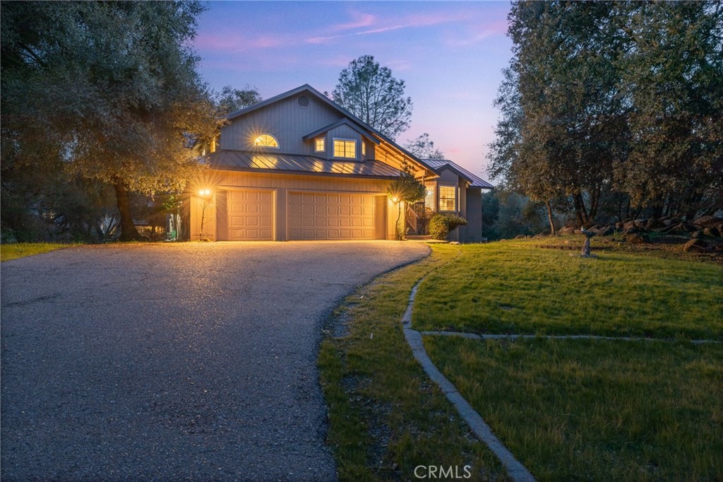39301 Moonray Lane Oakhurst, CA 93644 - Photo 55 of 55 a front view of a house with a yard