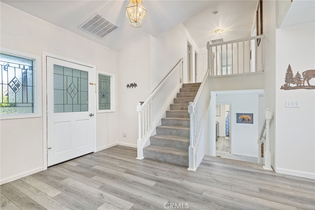 39301 Moonray Lane Oakhurst, CA 93644 - Photo 9 of 55 a view of entryway and hall with wooden floor