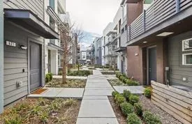 a view of a pathway along the building