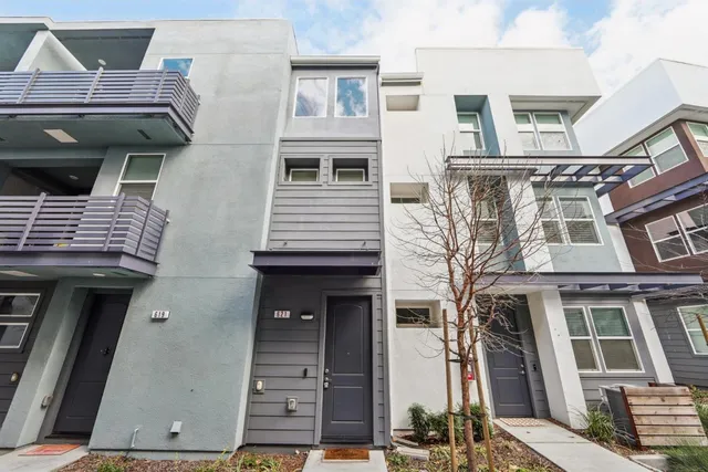 a front view of a house with glass windows
