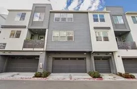a front view of a house with garage