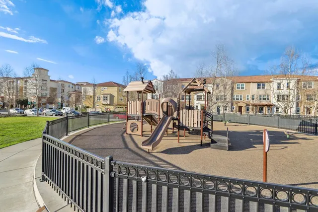 a view of a swimming pool with a table and chairs