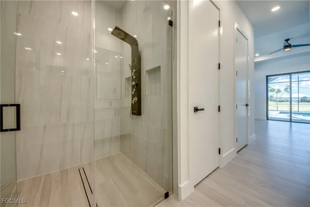 a bathroom with a glass shower door