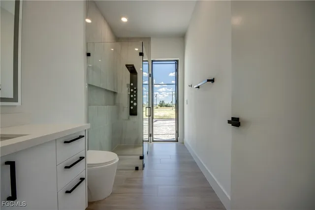 a bathroom with a toilet sink and shower