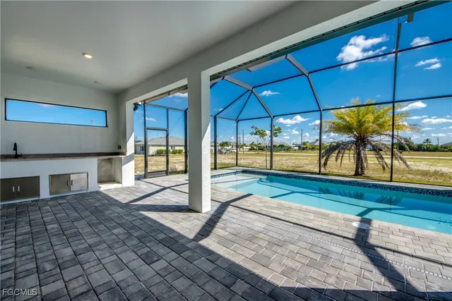 a view of a tables and chairs under an umbrella