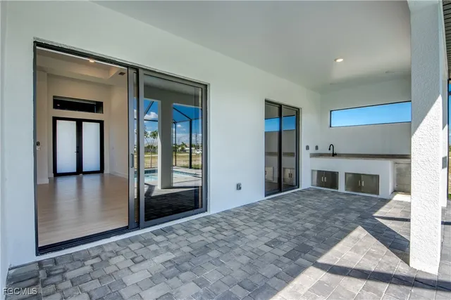 a view of a livingroom with wooden floor and a fireplace