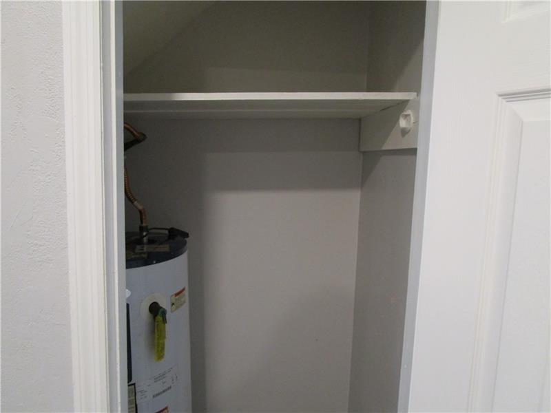 1235 Riverside Drive, Unit F6 Gainesville, GA 30501 - Photo 17 of 38 a close view of walk in closet with clothes