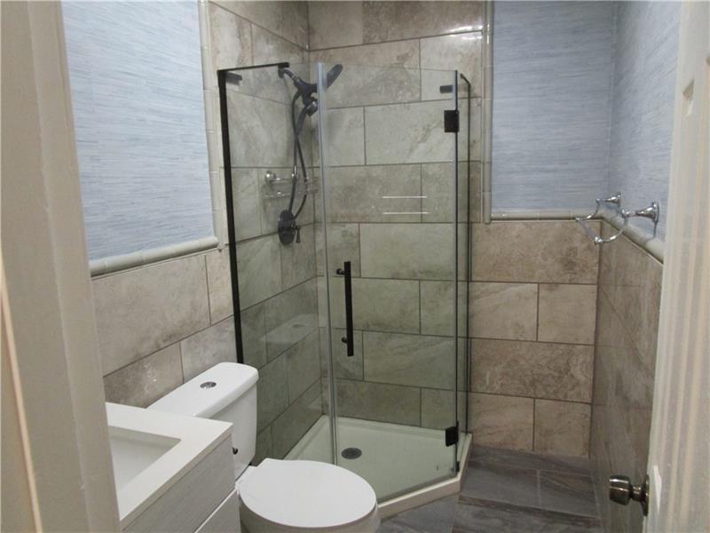 1235 Riverside Drive, Unit F6 Gainesville, GA 30501 - Photo 23 of 38 a bathroom with a toilet and a shower