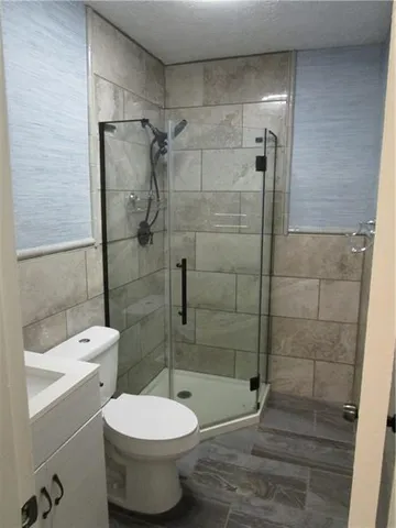 a bathroom with a toilet sink and shower