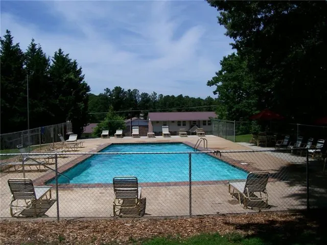 a view of a backyard with sitting area