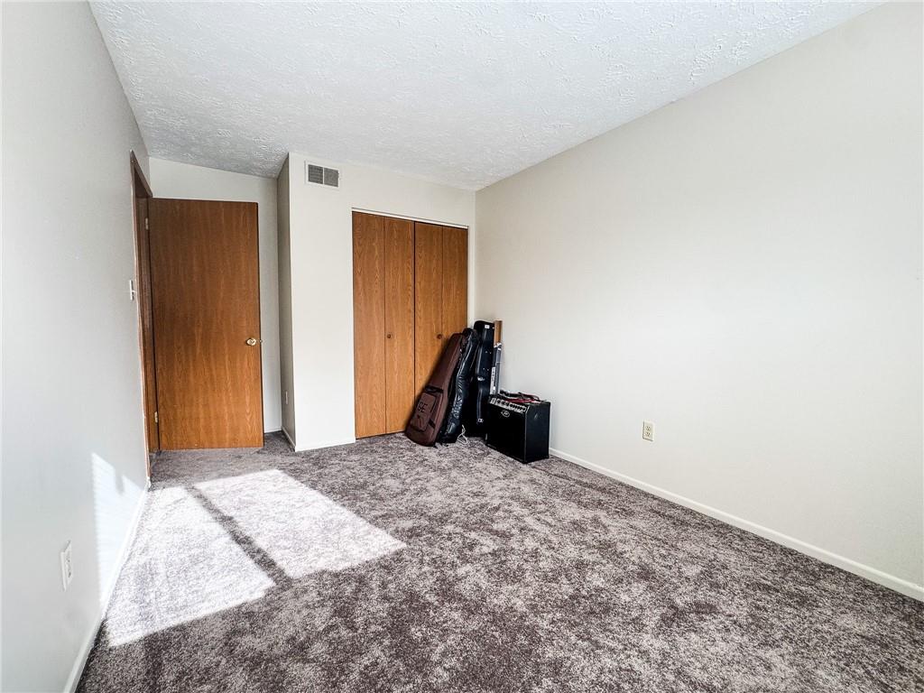 1201 Dutilh Road, Unit 12 Cranberry Township, PA 16066 - Photo 12 of 19 a bed room with a bed