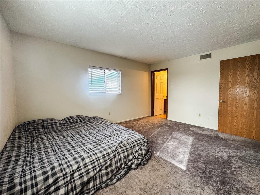 1201 Dutilh Road, Unit 12 Cranberry Township, PA 16066 - Photo 14 of 19 a bedroom with a bed and window