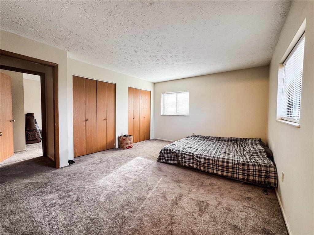 1201 Dutilh Road, Unit 12 Cranberry Township, PA 16066 - Photo 15 of 19 a spacious bedroom with a bed and a window
