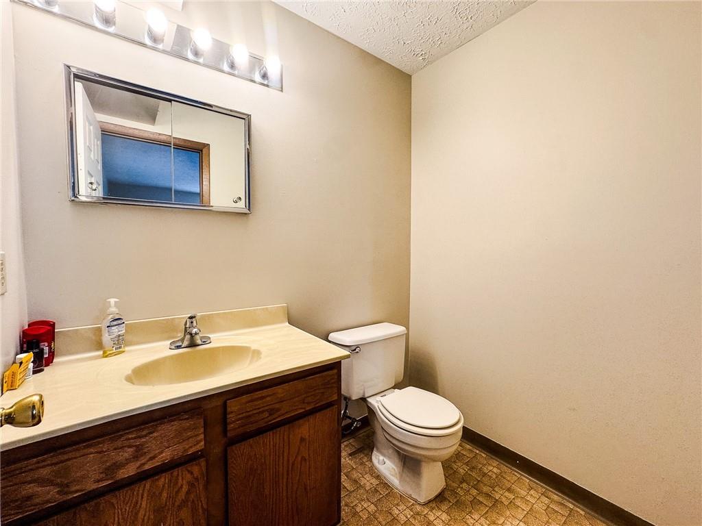 1201 Dutilh Road, Unit 12 Cranberry Township, PA 16066 - Photo 16 of 19 a bathroom with a sink mirror and toilet