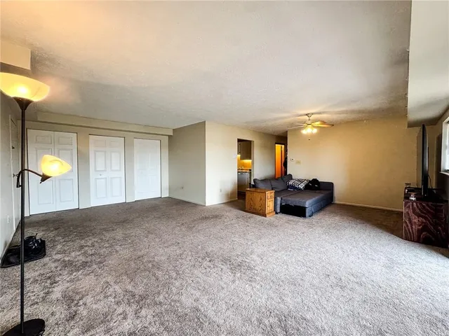 a view of a livingroom with furniture and a flat screen tv