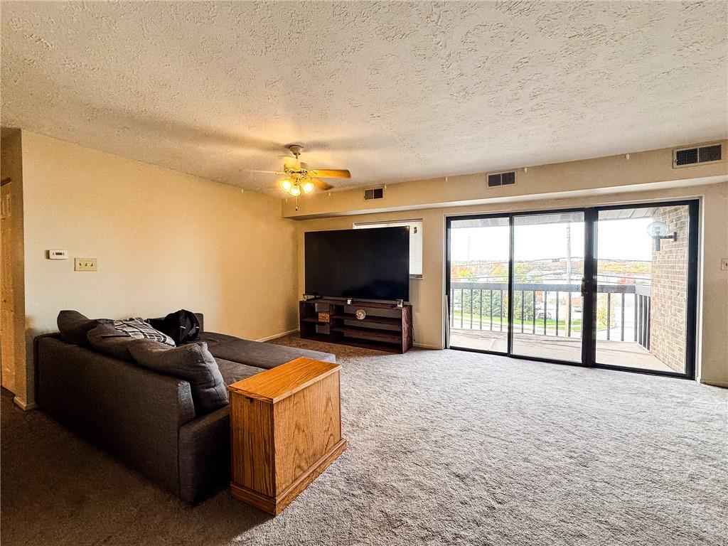 1201 Dutilh Road, Unit 12 Cranberry Township, PA 16066 - Photo 4 of 19 a living room with furniture and a flat screen tv