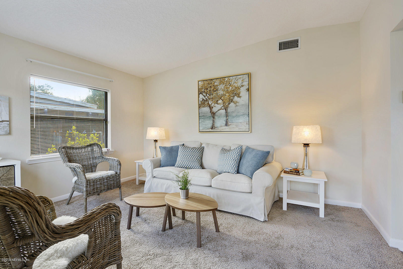 10568 Villanova Road Jacksonville, FL 32218 - Photo 7 of 27 a living room with furniture and a lamp