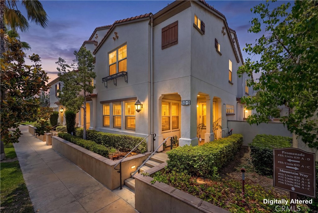 849 The Promenade, Unit D Azusa, CA 91702 - Photo 4 of 37 a front view of a house with lots of green space