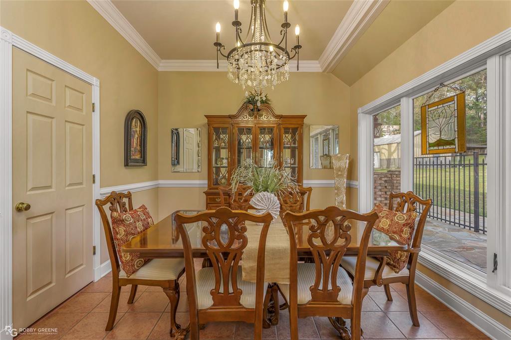 195 Tanglewood Road Homer, LA 71040 - Photo 11 of 37 a view of a dining room with furniture wooden floor and chandelier