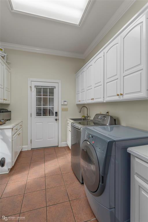 195 Tanglewood Road Homer, LA 71040 - Photo 14 of 37 a utility room with cabinets washer and dryer
