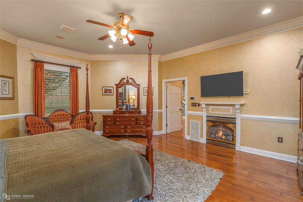 195 Tanglewood Road Homer, LA 71040 - Photo 15 of 37 a bedroom with a bed and a flat screen tv