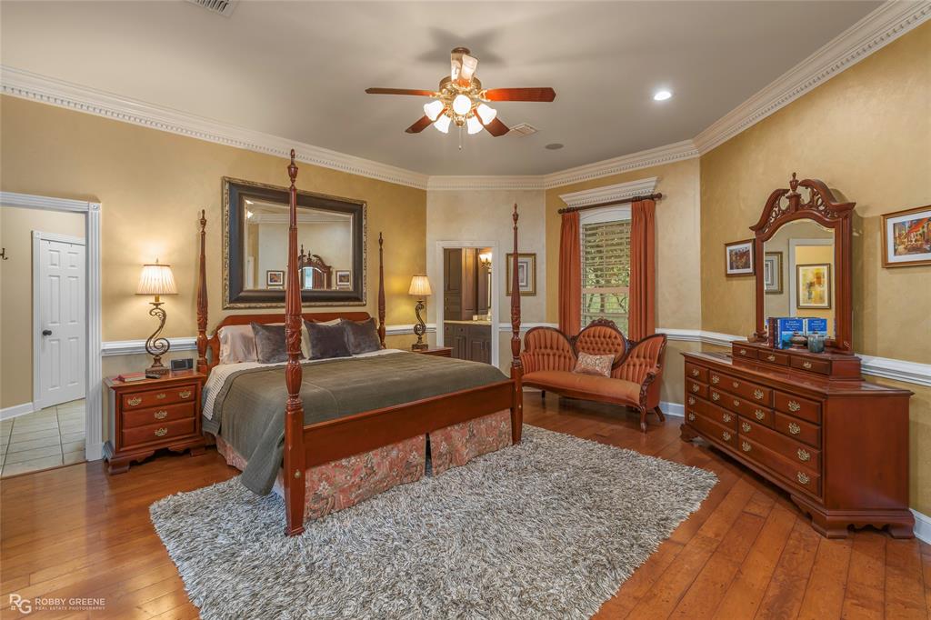 195 Tanglewood Road Homer, LA 71040 - Photo 16 of 37 a living room with furniture and a chandelier