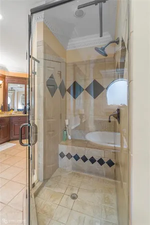 a bathroom with a tub sink and mirror