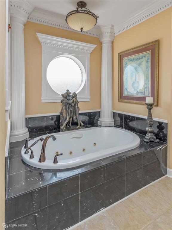 195 Tanglewood Road Homer, LA 71040 - Photo 19 of 37 a bathroom with a tub sink and mirror