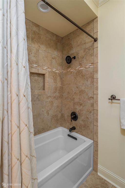 195 Tanglewood Road Homer, LA 71040 - Photo 22 of 37 a bath tub sitting next to a white sink and a shower