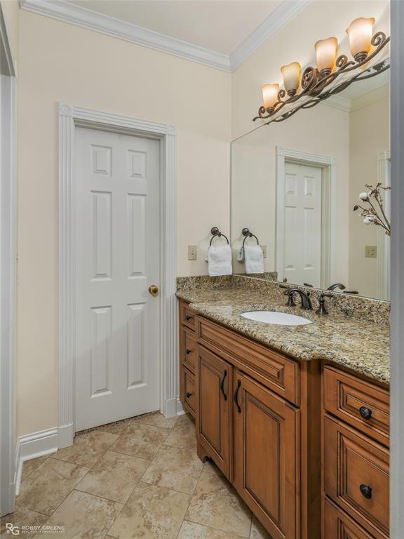195 Tanglewood Road Homer, LA 71040 - Photo 28 of 37 a bathroom with a granite countertop sink and a mirror