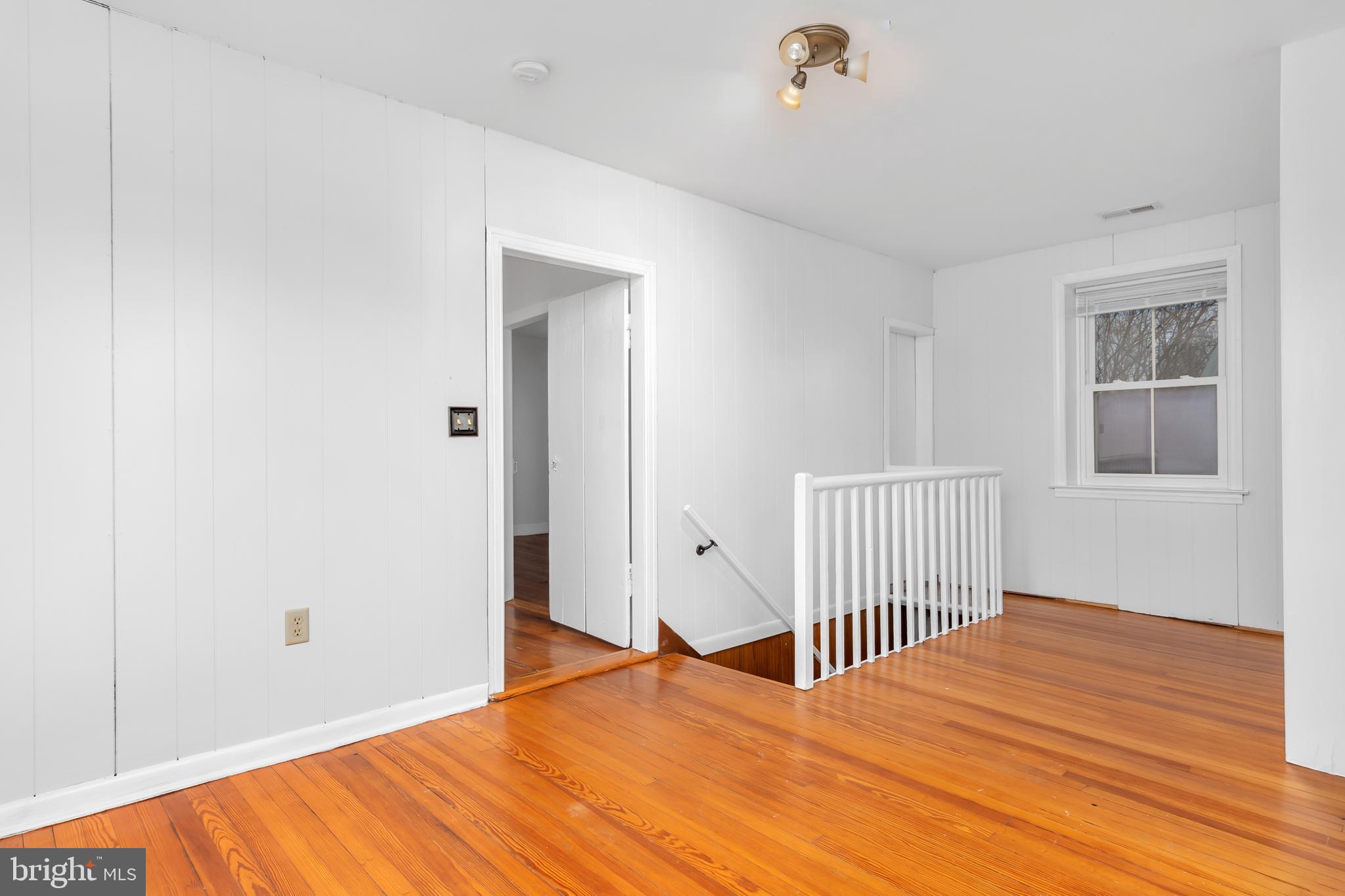 2730 Marker Road Middletown, MD 21769 - Photo 30 of 73 a bedroom with a bed and wooden floor