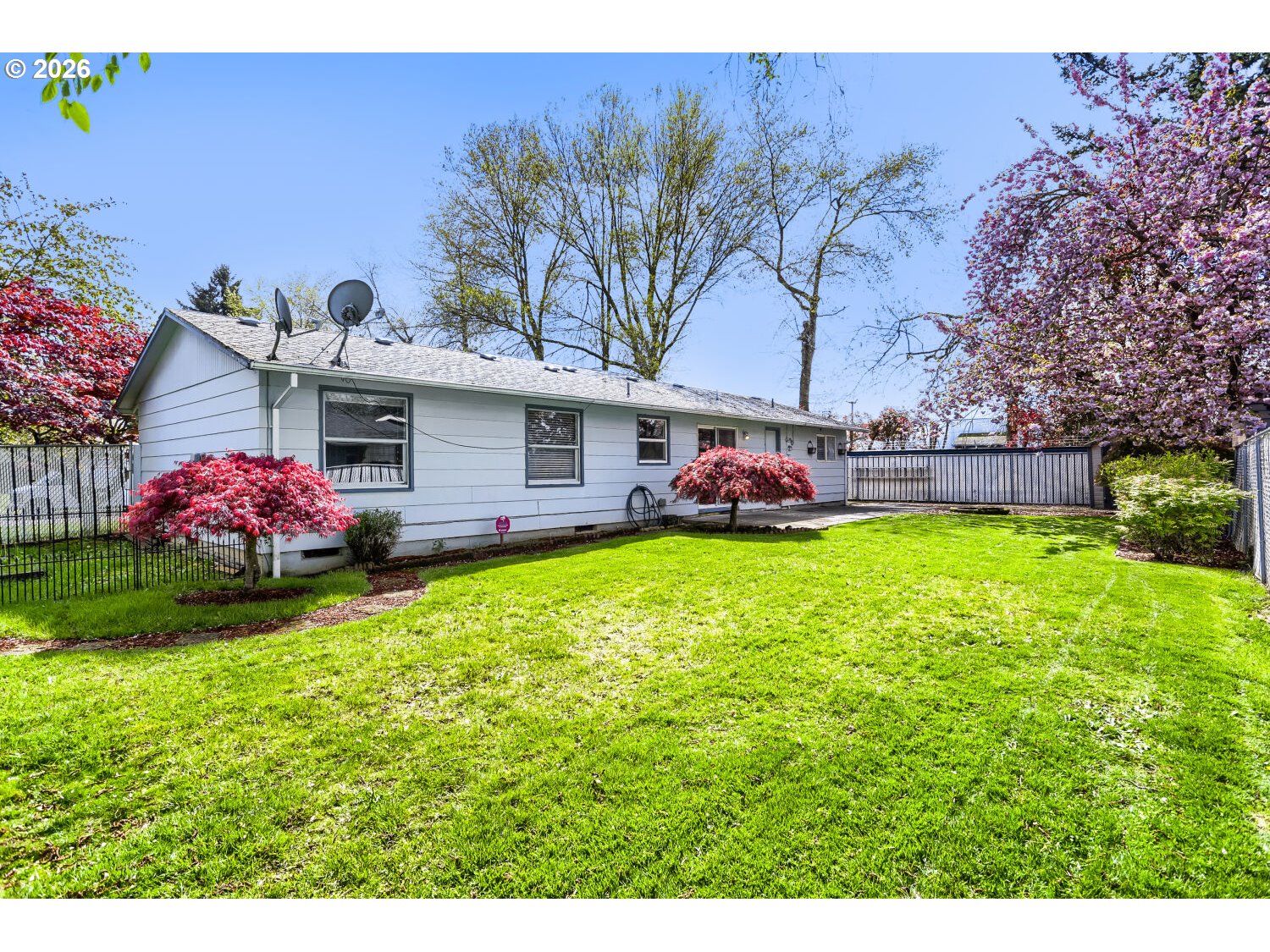 1675 Northeast Juniper Avenue Gresham, OR 97030 - Photo 24 of 29 a front view of a house with garden