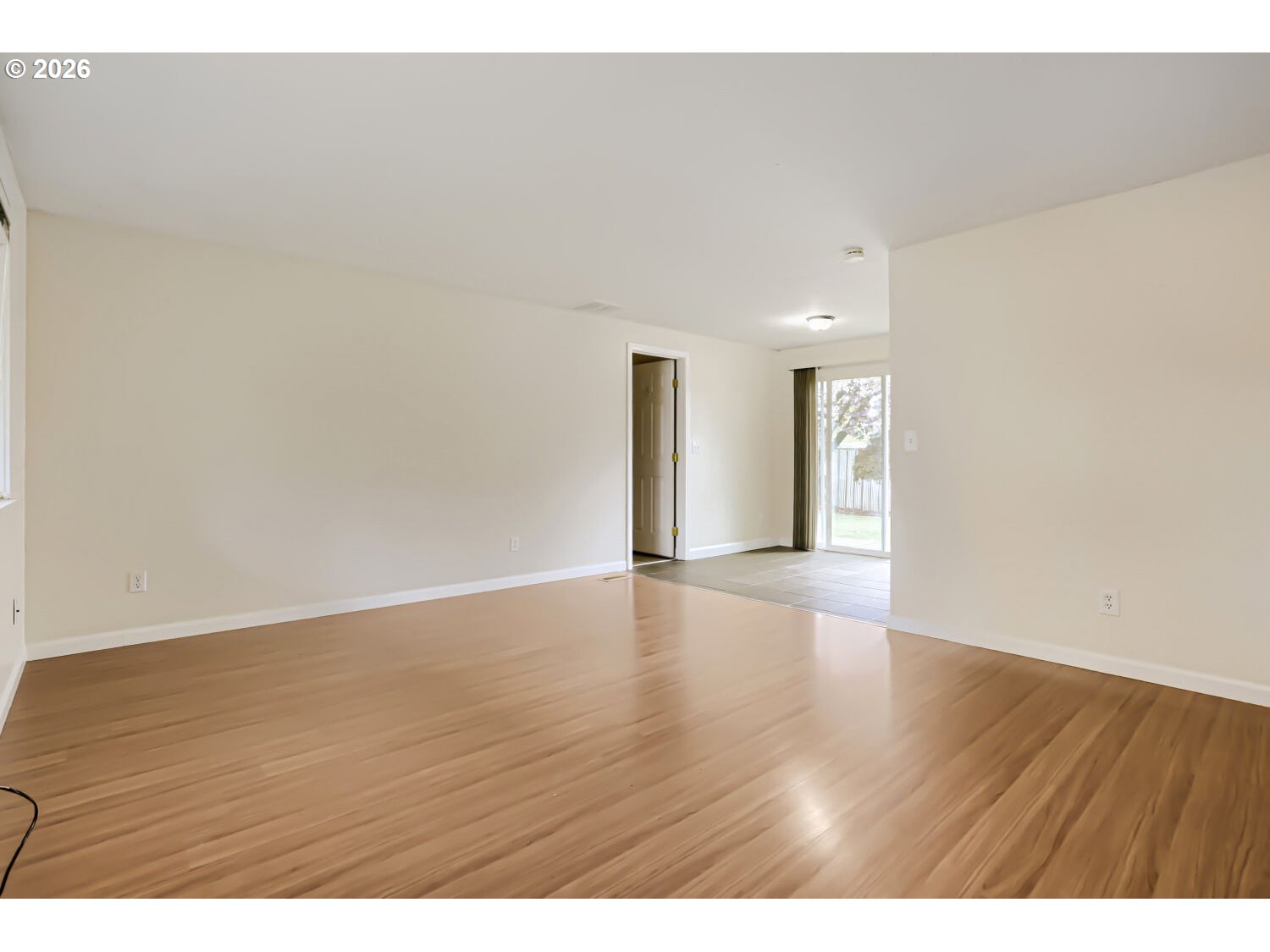 1675 Northeast Juniper Avenue Gresham, OR 97030 - Photo 4 of 29 a view of an empty room and wooden floor