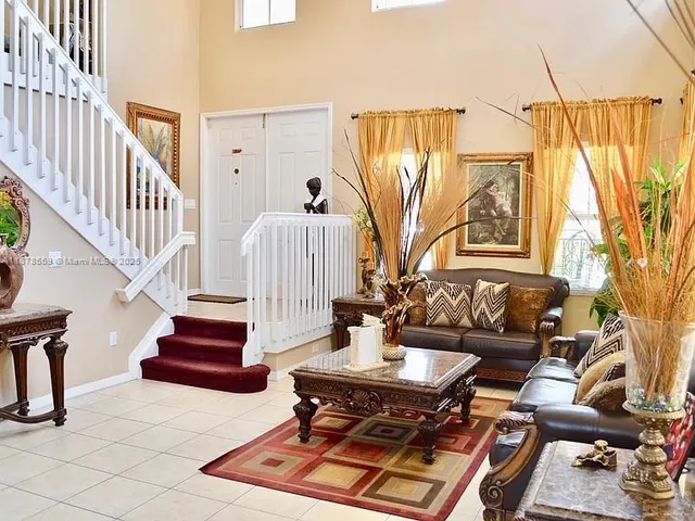 a living room with furniture and a table