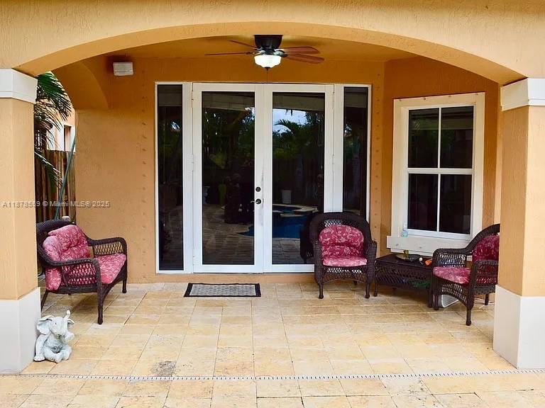 15601 Southwest 31st Lane Miami, FL 33185 - Photo 12 of 18 a patio with glass top table and chairs