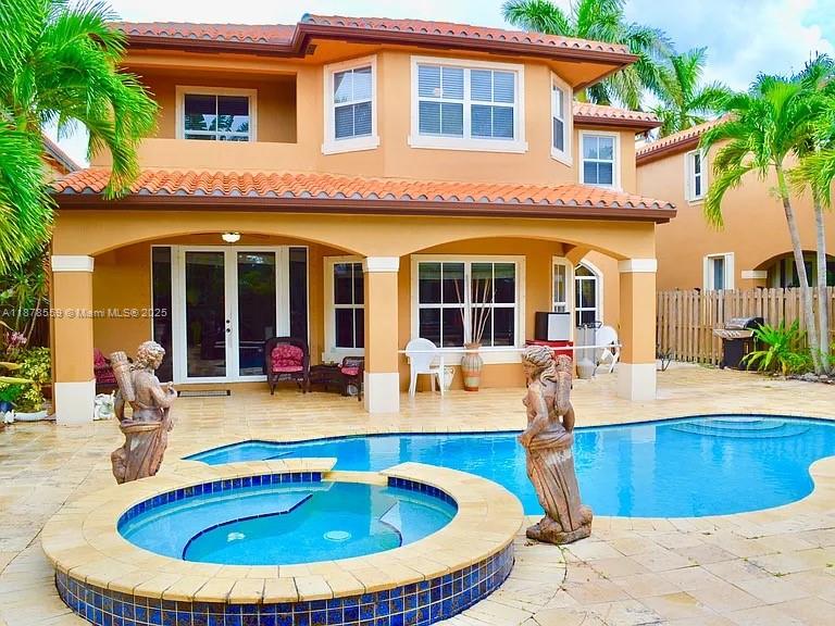 15601 Southwest 31st Lane Miami, FL 33185 - Photo 13 of 18 a view of a house with swimming pool and sitting area