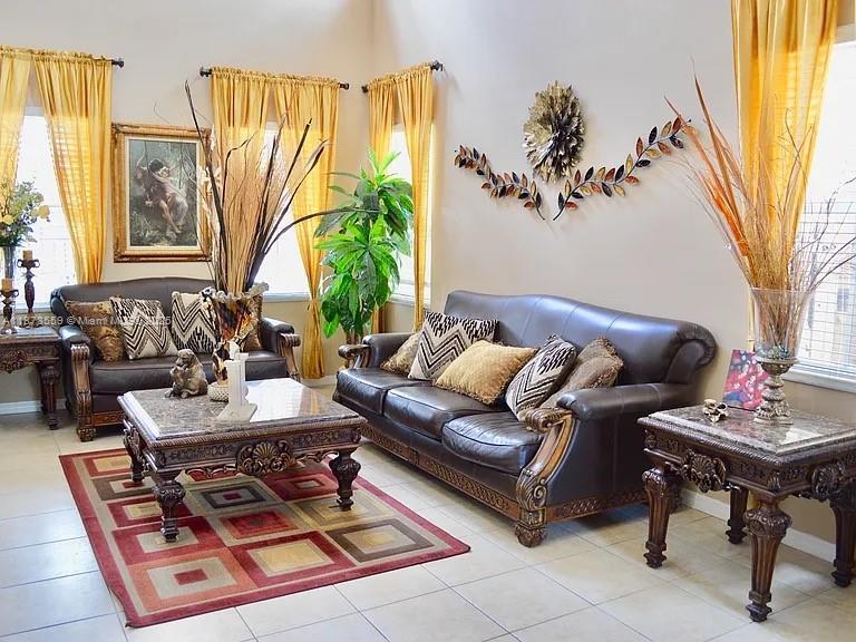 15601 Southwest 31st Lane Miami, FL 33185 - Photo 2 of 18 a living room with furniture and a window