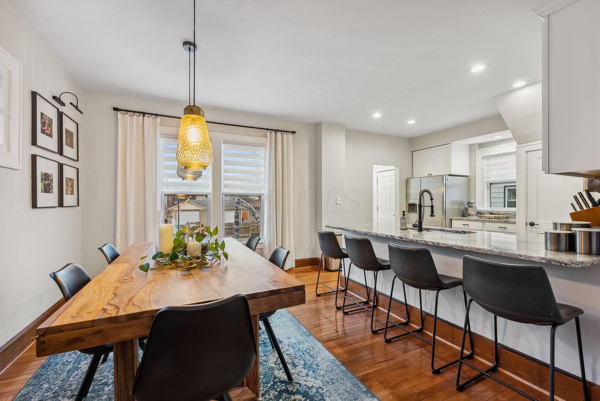 369 East Kelso Road Columbus, OH 43202 - Photo 12 of 48 Dining area and kitchen bar