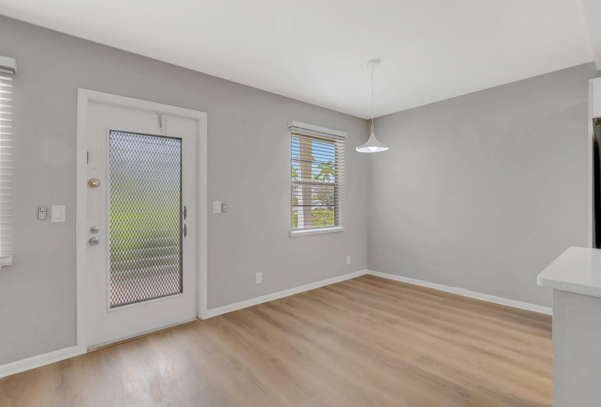 296 Fanshaw H Boca Raton, FL 33434 - Photo 11 of 59 a view of an empty room with closet and a window