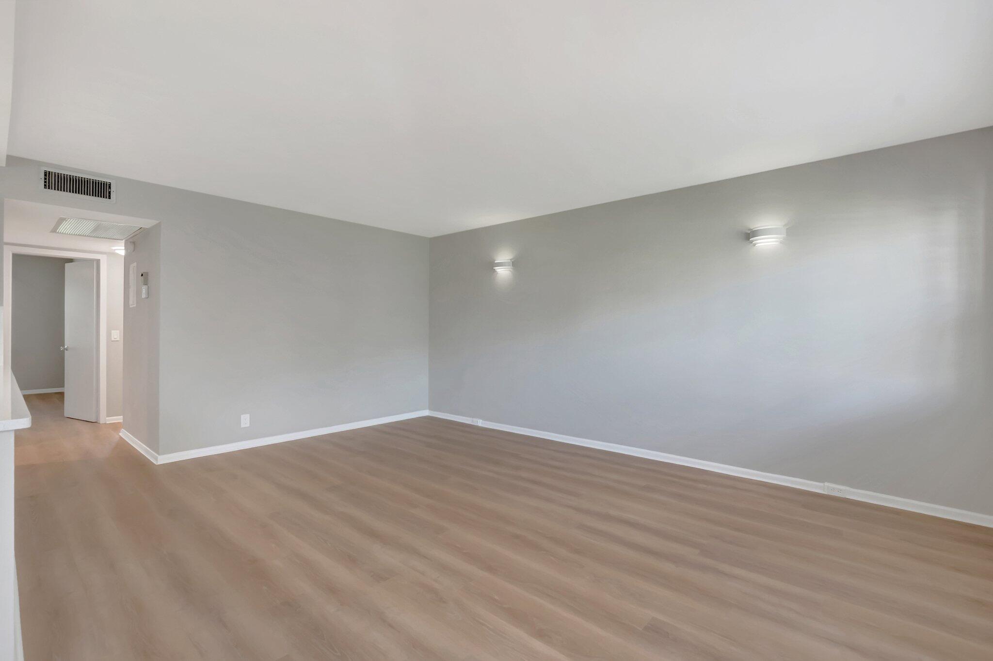296 Fanshaw H Boca Raton, FL 33434 - Photo 8 of 59 a view of an empty room with wooden floor