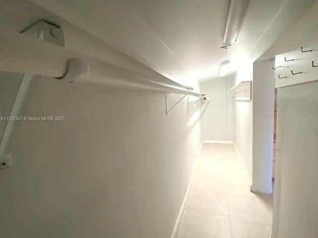 a view of an empty room and window