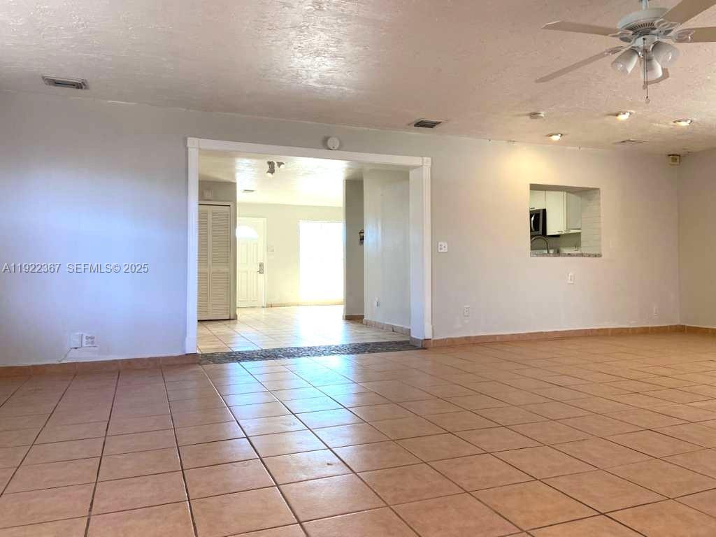 8825 Southwest 19th Street, Unit 8825 Miami, FL 33165 - Photo 6 of 21 Family Room towards kitchen and dining room